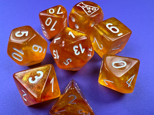 Borealis Luminary Blood Orange polyhedral set, showing off brilliant sparkly orange dice.