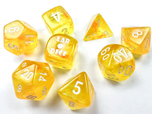 Borealis Luminary Canary polyhedral set, showing off brilliant sparkly yellow dice.