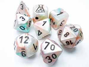 A set of multicolored polyhedral dice with numbers visible, released as a test print by Chessex Lab.