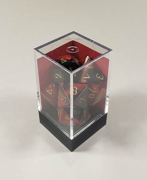 A close up of the Chessex Gemini Black and Red polyhedral dice set in its package.