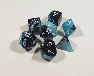 A close up of the Chessex Gemini Black and Shell polyhedral dice set.