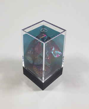 A close up of the Chessex Gemini Purple Teal polyhedral dice set in its package.