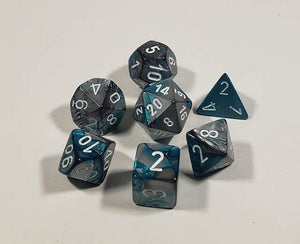 A close up of the Chessex Gemini Steel and Teal polyhedral dice set.