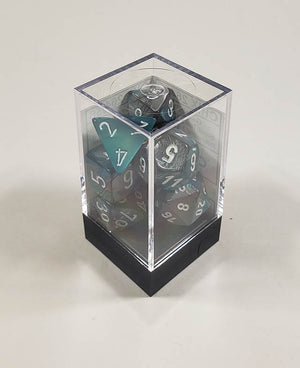 A close up of the Chessex Gemini Steel and Teal polyhedral dice set in its package.