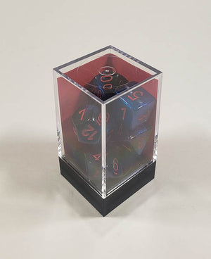 A close up of the Chessex Gemini Black and Starlight polyhedral dice set in its package.