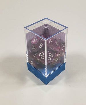 A close up of the Chessex Lustrous Amethyst polyhedral dice set in its package.