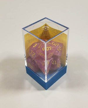 A close up of the Chessex Leaf Fucia polyhedral dice set in its package.