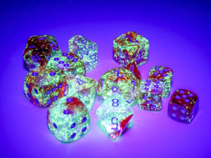Many of the dice the Chessex Nebula Red with Silver dice sets under a black light.