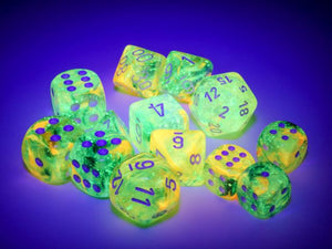 Examples of many dice from the various Nebula Spring dice sets under a black light.