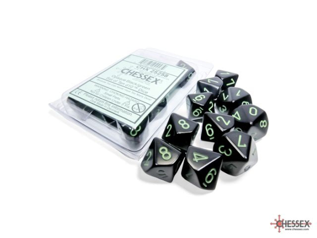 A set of black opaque dice with green numbers, packaged in a clear plastic container with a white label.