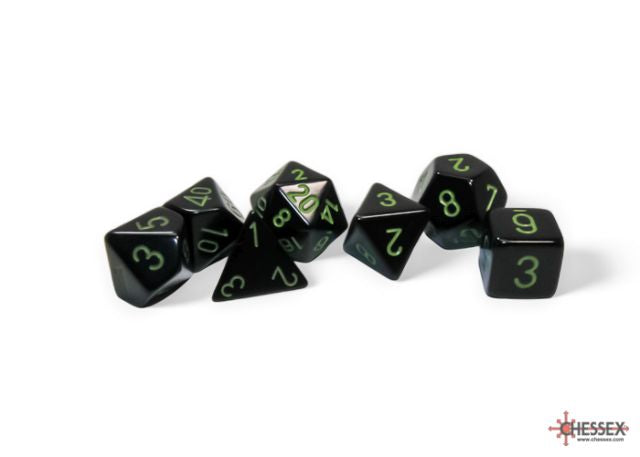 A set of black polyhedral dice with green numbers, including various shapes such as four-sided, six-sided, eight-sided, ten-sided, twelve-sided, twenty-sided, and percentile dice.