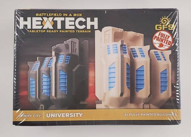 Packaging for BattleTech Hextech Terrain W01 University terrain set, featuring two pre-painted buildings in different paint schemes.