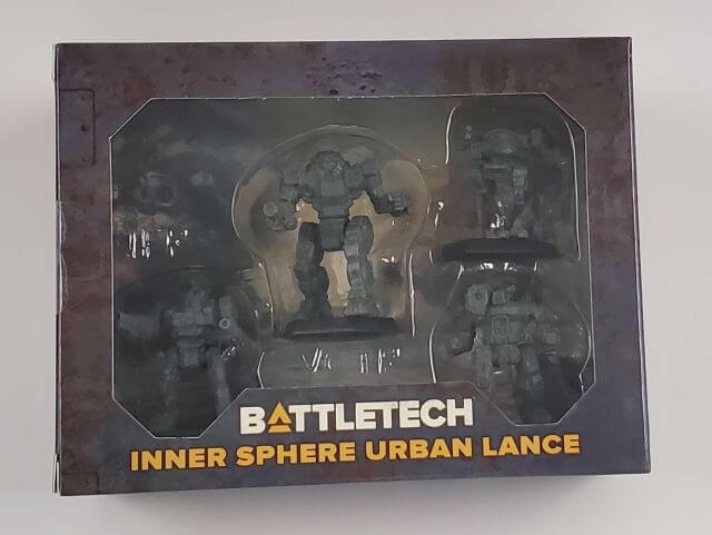 The product image shows the BattleTech Inner Sphere Urban Lance set, with visible BattleMechs in plastic packaging, including Victor, Enforcer, Hunchback, and Raven models.