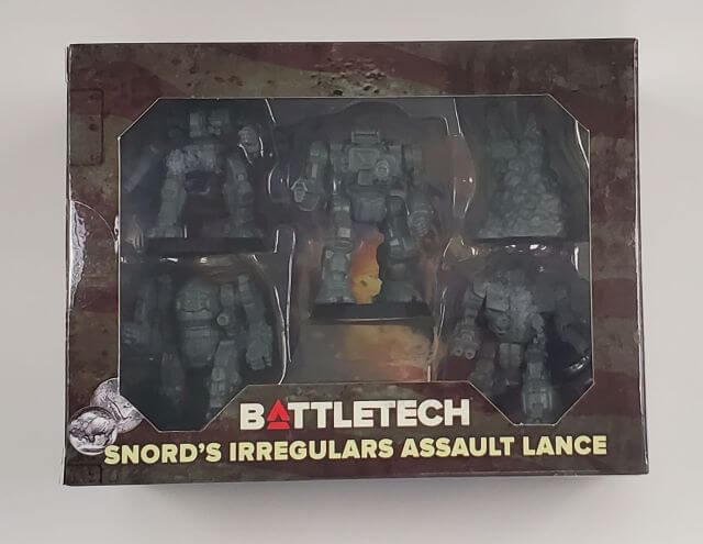 Packaging for BattleTech: Snord's Irregulars Assault Lance with several assembled metal miniatures visible through a clear plastic window, along with the product name and description.