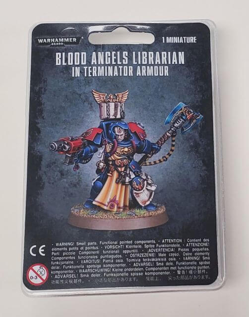 Packaging for Blood Angels Librarian in Terminator Armour miniature, featuring the assembled and painted model on a plastic blister pack with Games Workshop branding.