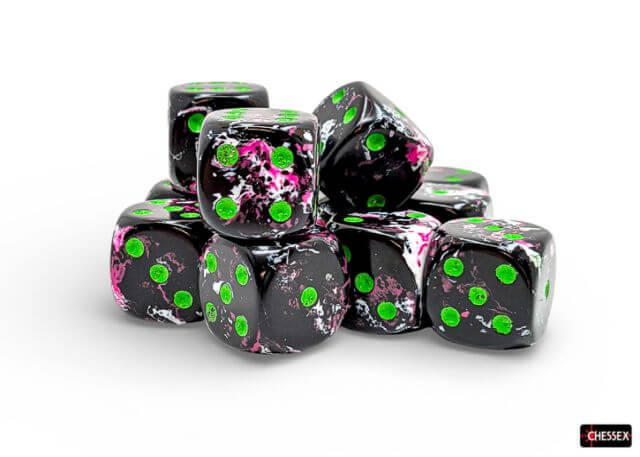 Set of Chessex dice with black, pink, and green patterns on a white background