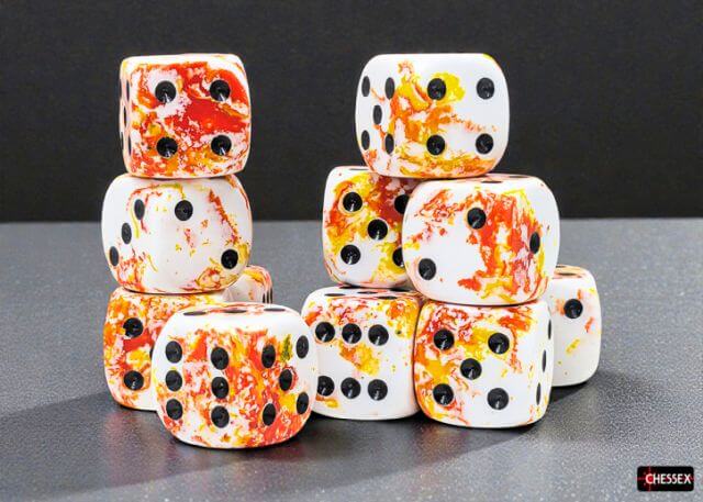 Marbled dice with black dots stacked on a dark surface