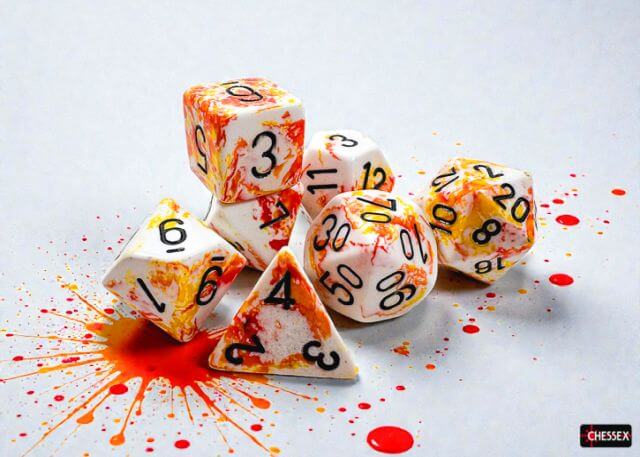 Dice with pizza-themed design on a white background with red splashes
