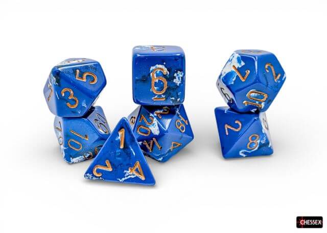 Set of blue polyhedral dice with gold numbers on a white background, featuring the Chessex brand.