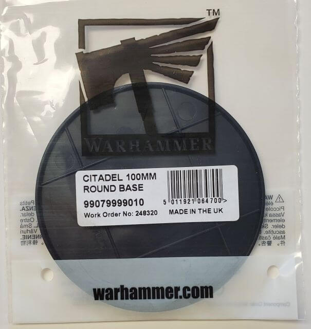 Packaged Citadel 100mm Round Base for model making, with the Warhammer brand visible on the packaging.