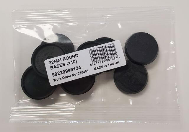 A pack of ten black 32mm round bases for miniature figures, still sealed in anti-static packaging with a label showing the product details and barcode.