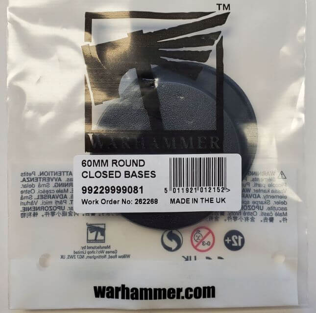 Packaging of Citadel 60mm Round Bases showing the product inside a clear plastic bag with a label indicating it is a round closed base, made in the UK, with the Warhammer brand visible.