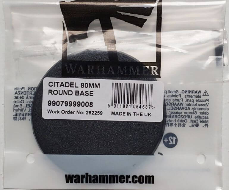 Packaged Citadel 80mm Round Base for model making, still in plastic wrapping with labels and barcodes visible.