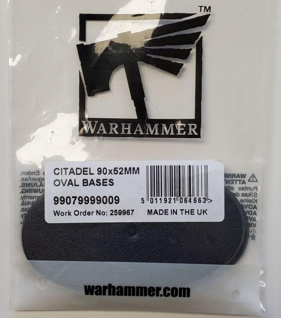 Packaging of Citadel 90x52mm Oval Bases with the Warhammer logo, product information, and barcode visible.