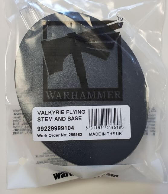Product packaging for a Warhammer Citadel Flying Stem and Base, displaying the base itself and its dimensions, work order number, and the text 'MADE IN THE UK'.