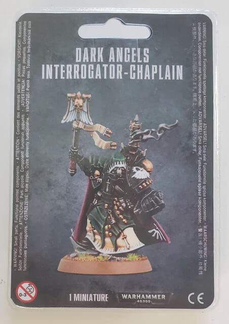 Packaging for Dark Angels Interrogator-Chaplain miniature, featuring the assembled and painted model on a card with product information.