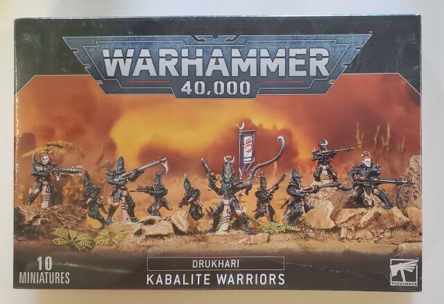A box set of Warhammer 40,000 Drukhari Kabalite Warriors miniatures, featuring multiple figures with different variants of legs, heads, and bodies.
