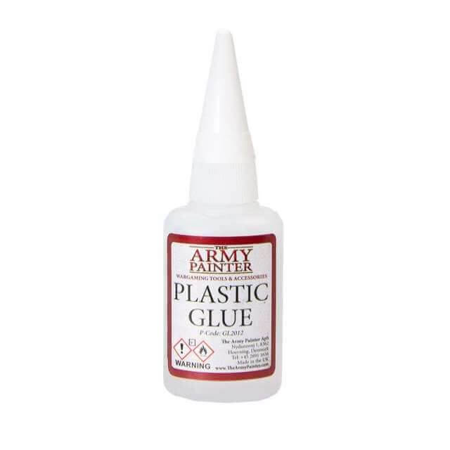 A bottle of Plastic Glue with a white cap.