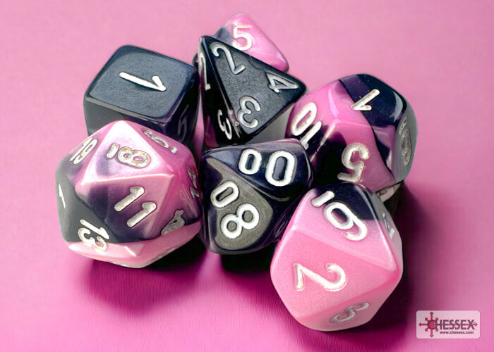 A close of the Chessex Gemini Black-Pink with white mini dice set.