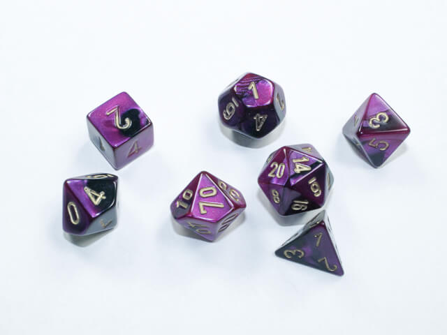 A close of the Chessex  Gemini Black-Purple mini dice set.
