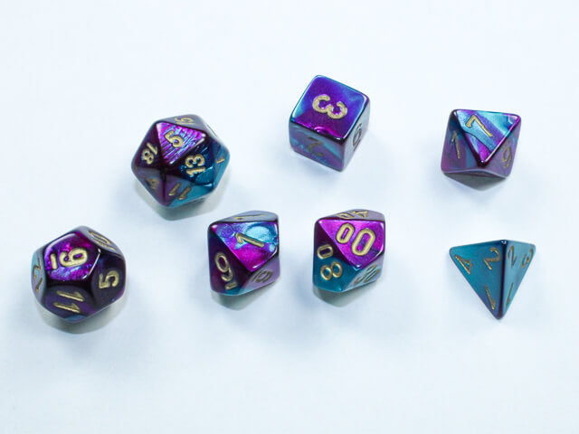 A close of the Chessex  Gemini purple-teal mini dice set.