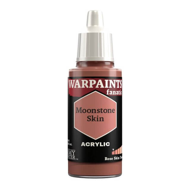 A bottle of Warpaints Fanatic Moonstone Skin acrylic paint in a deep yellowish pink color.