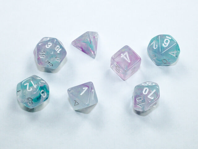 A close of the Chessex Nebula Wisteria with white mini dice set.