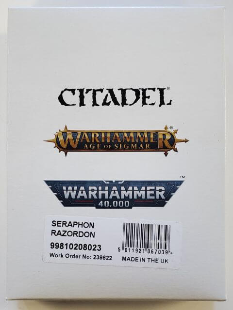 Packaging for Age of Sigmar Seraphon Raxordon miniature kit featuring logos and product name.