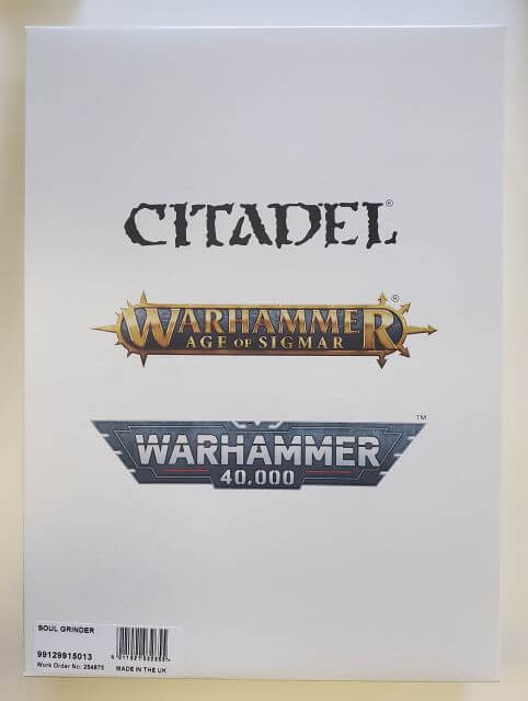 Packaging for Slaves to Darkness Soul Grinder miniature, featuring the product name and the Warhammer 40,000 and Age of Sigmar series branding.