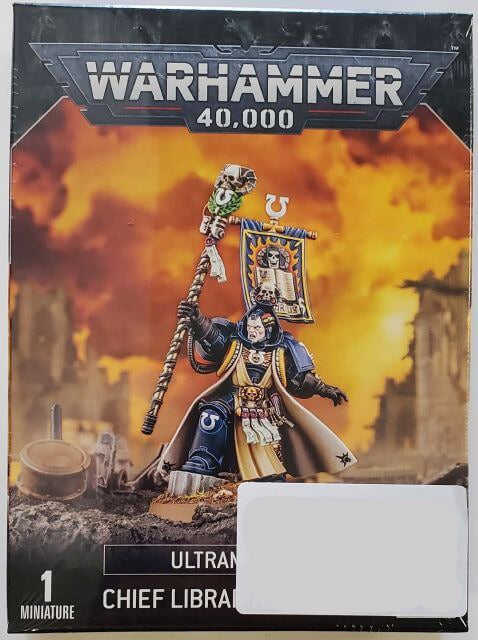 Packaging for Warhammer 40,000 Space Marines Ultramarines Chief Librarian Tigurius miniature figure, showing the miniature itself on the front with a fiery background, and the back with product information.