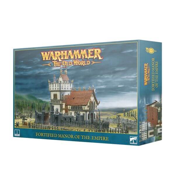 Boxed modular plastic kit for building a fortified manor, titled 'The Old World Fortified Manor of the Empire' for the Warhammer game, depicting a detailed model of a house and tower with surrounding walls and fences.