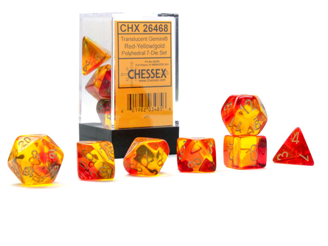 A set of translucent red and yellow polyhedral dice with gold accents, displayed both in and out of a clear packaging box.