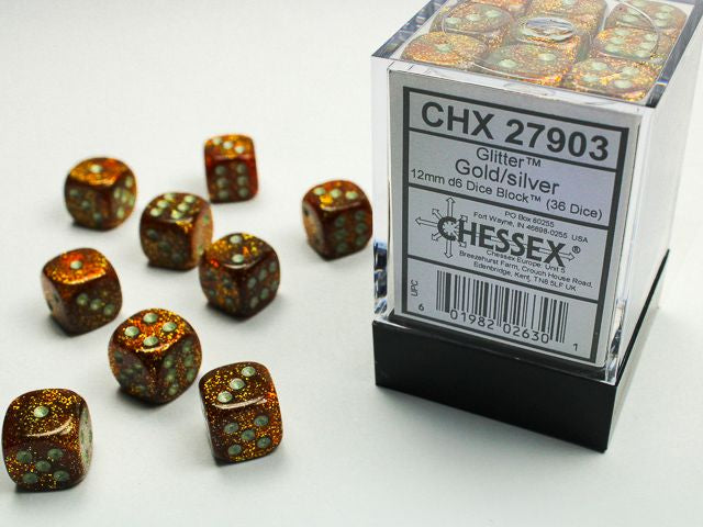 A close up of the Chessex Glitter Ruby gold with silver 12mm d6 dice set along with its' packaging.