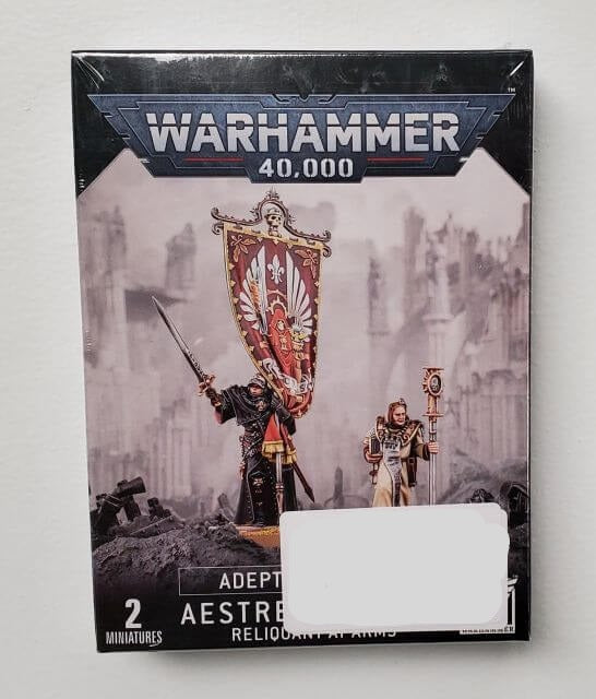 Packaging for Warhammer 40,000 Adepta Sororitas Aestred Thurga, Reliquant at Arms miniatures, featuring illustrated characters on the front.