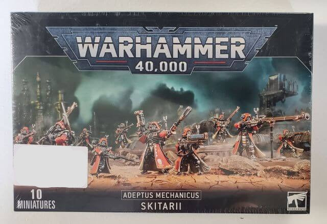 Packaging for Warhammer 40,000 Adeptus Mechanicus Skitarii miniatures, featuring illustrated battle scenes and the text '10 MINIATURES'.
