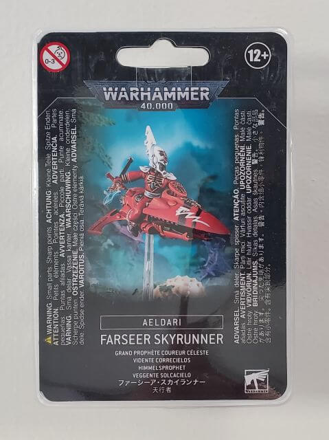 Packaged Aeldari Farseer / Warlock Skyrunner model kit from Warhammer 40,000, featuring the product on the front with a red and black color scheme.