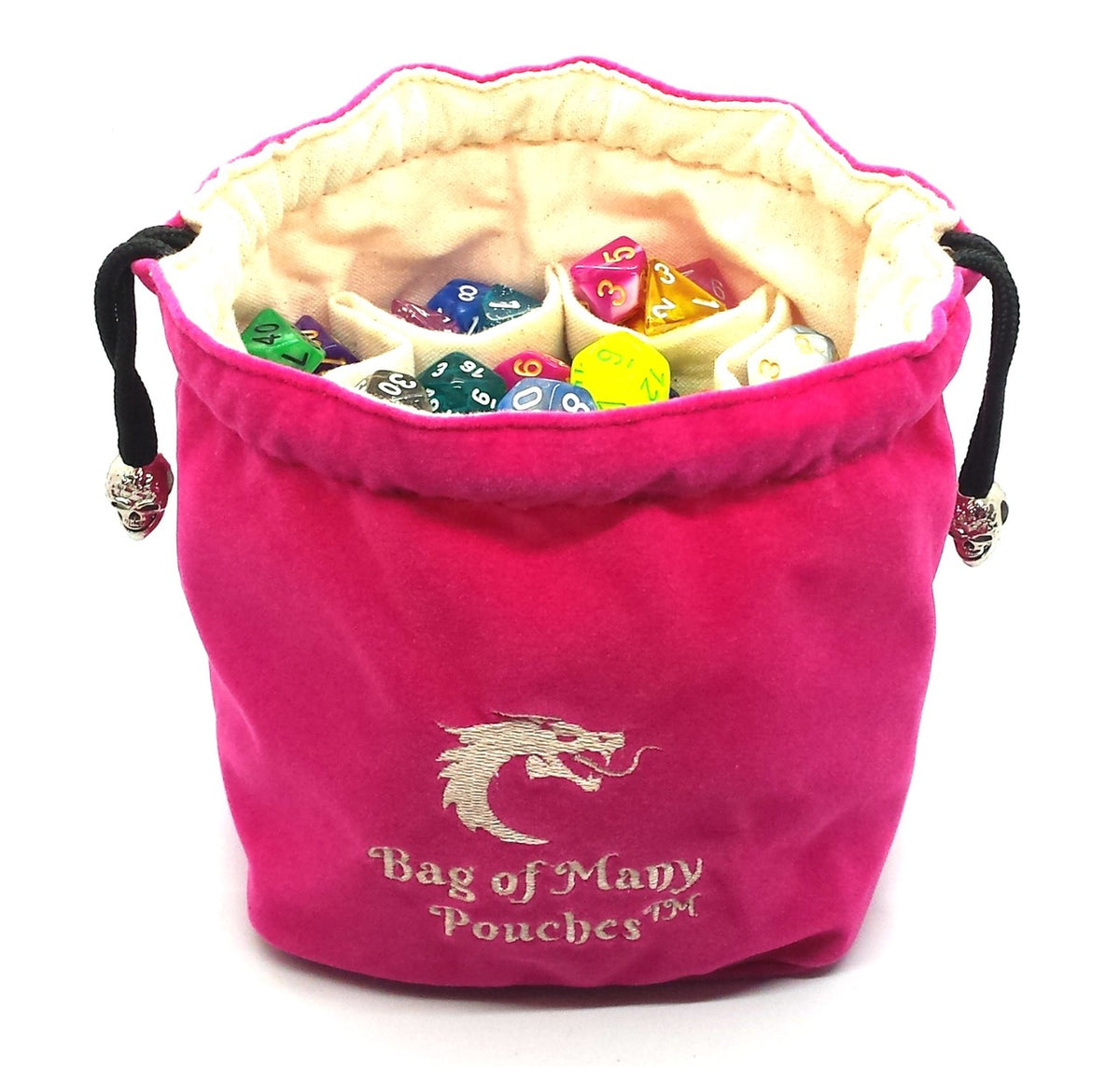 A pink dice bag with multiple compartments, standing upright and filled with various colorful dice. It features silver skull toggles and embroidery with the text 'Bag of Many Pouches' and the Dragon Head logo.