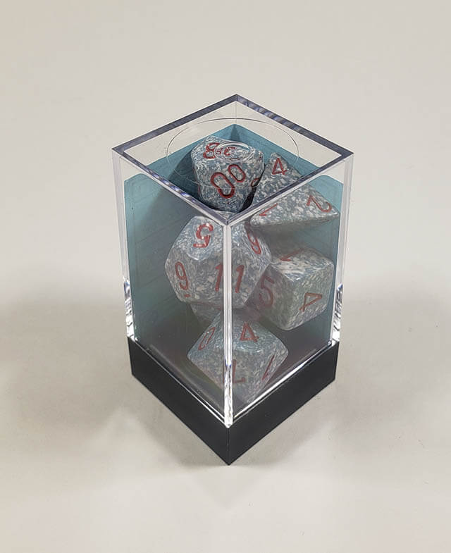 A close up of the Chessex specked air polyhedral dice set in its package.
