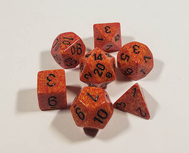 A close up of the Chessex specked fire polyedral dice set