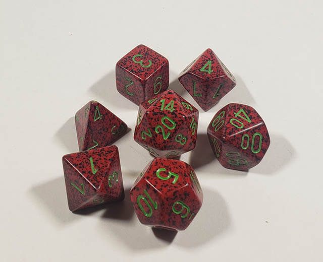 A close up of the Chessex specked Strawberry polyhedral dice set.